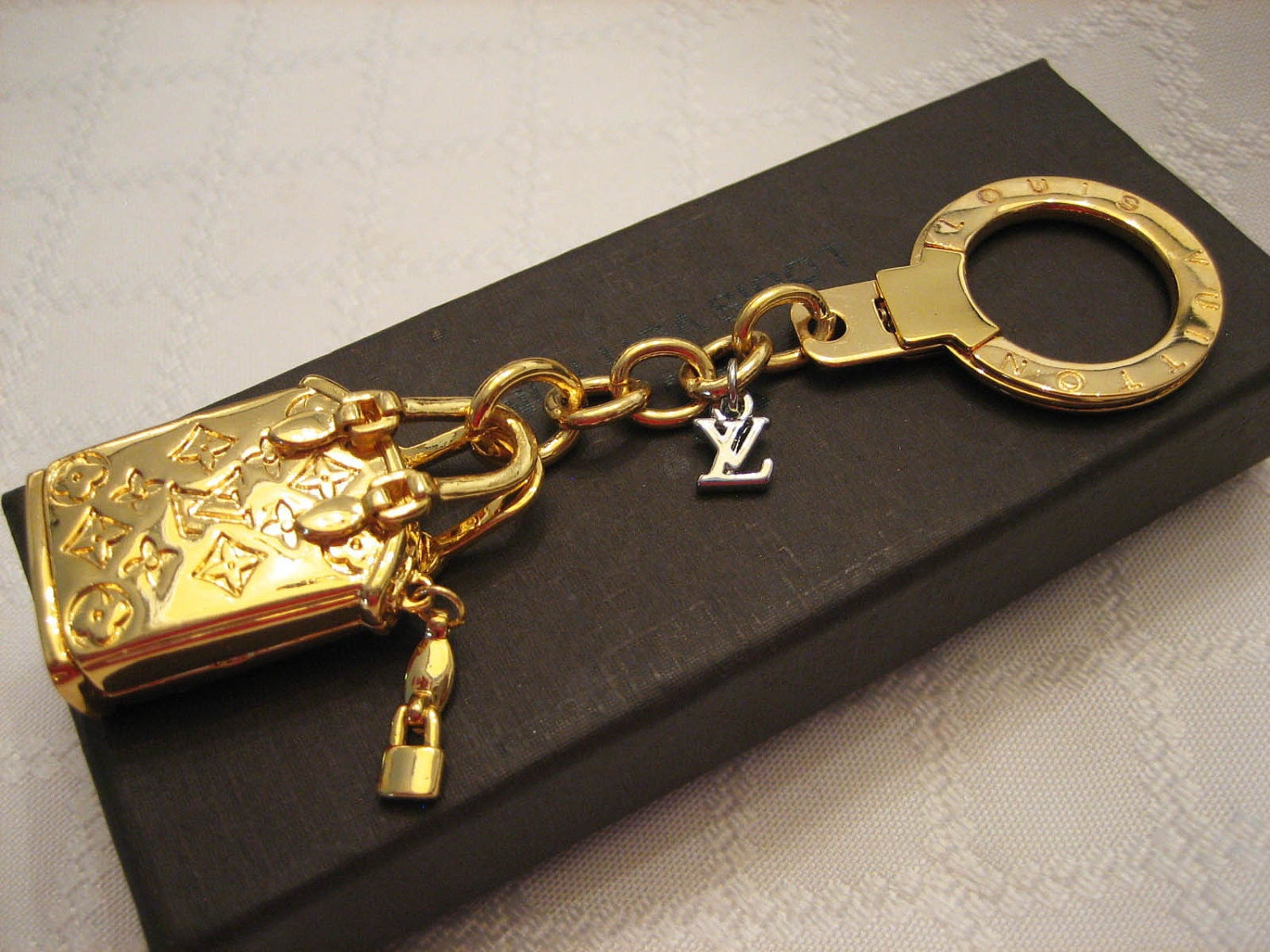 Louis Vuitton Key Chain Purse Charm Gold Lockit by shoppingforbags