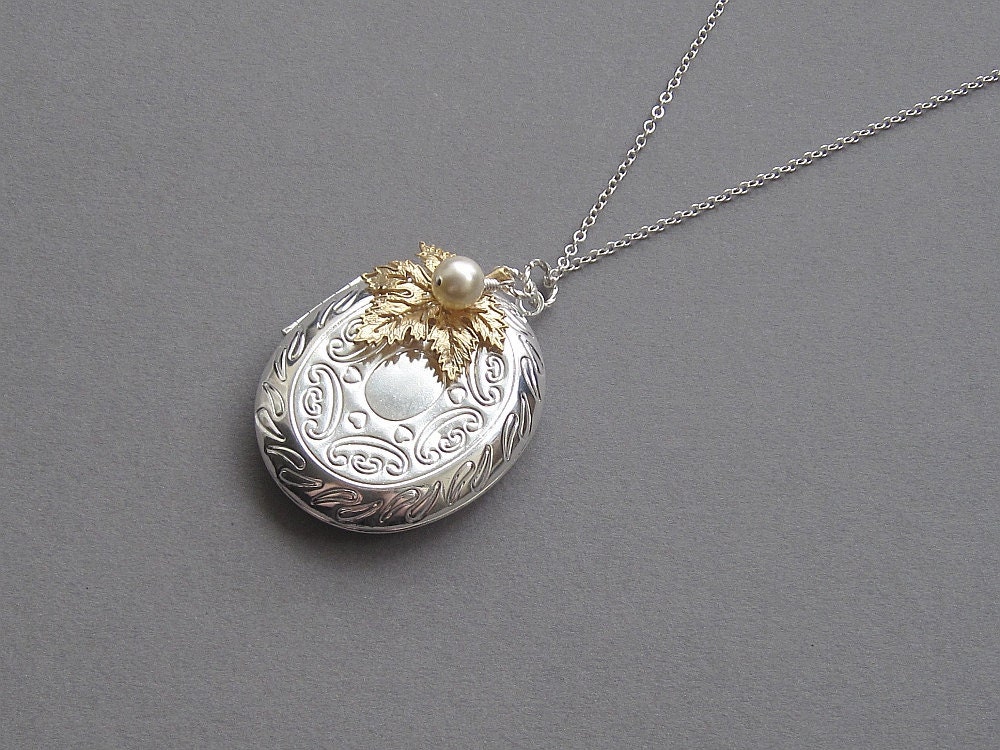 Silver locket necklace, large oval, gold maple leaf, cream swarovski pearl, long silver chain