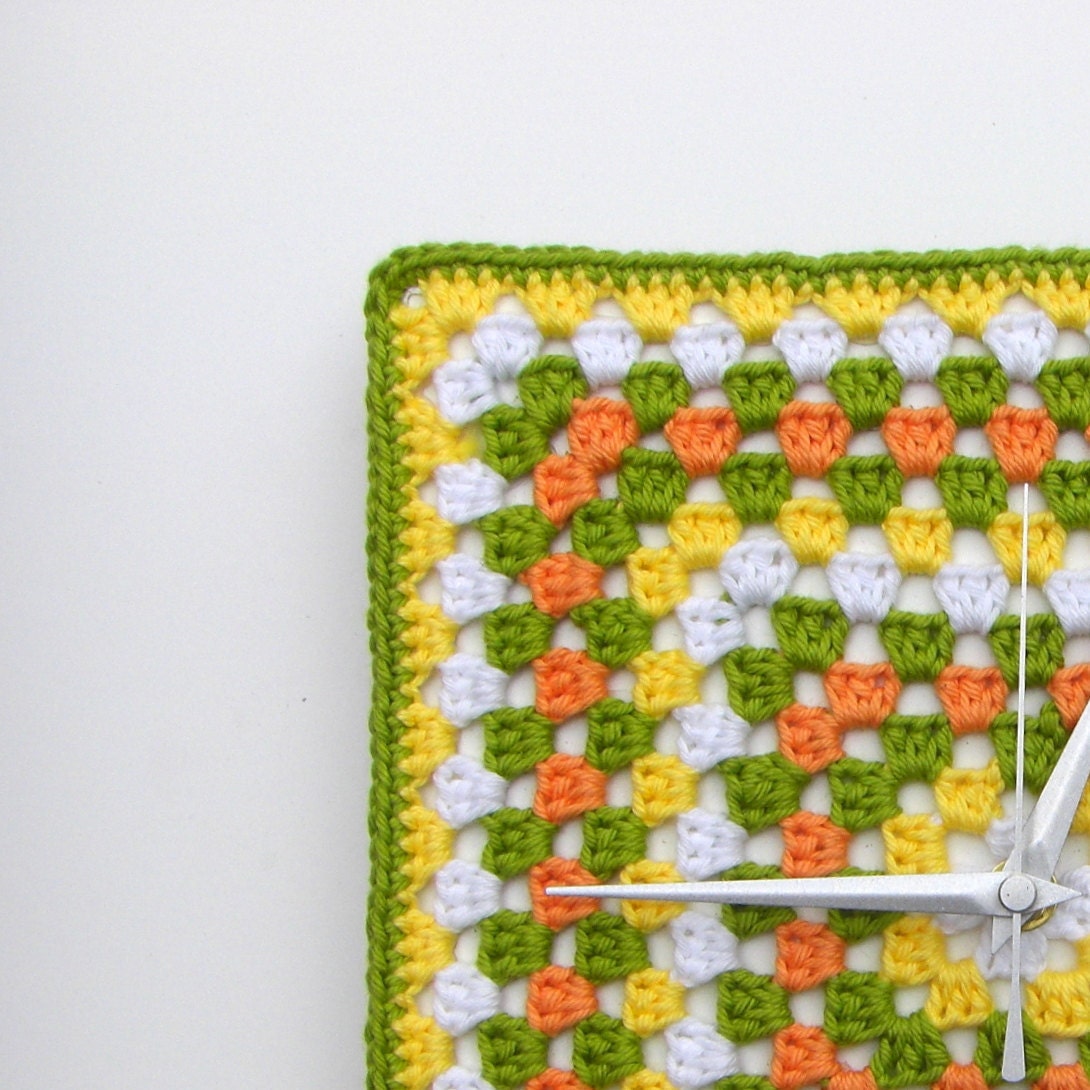 Granny square wall clock in green, yellow, orange and white