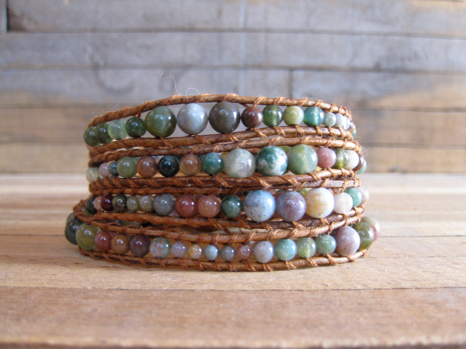 Beaded leather wrap bracelet graduated semi-precious stones on saddle colored leather