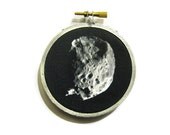 Saturn's moons, the face of Phoebe in embroidery hoop: NASA inspired wall hanging