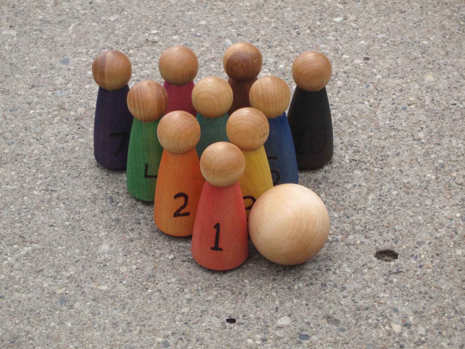 Little person wooden bowling set.  Learn colors and numbers.  Great for toddlers.