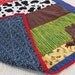 ChristmasInJuly Boy's Cowboy Quilt, crib/toddler size, Rodeo scrappy strip blanket with appliqued cowboy boot, OOAK