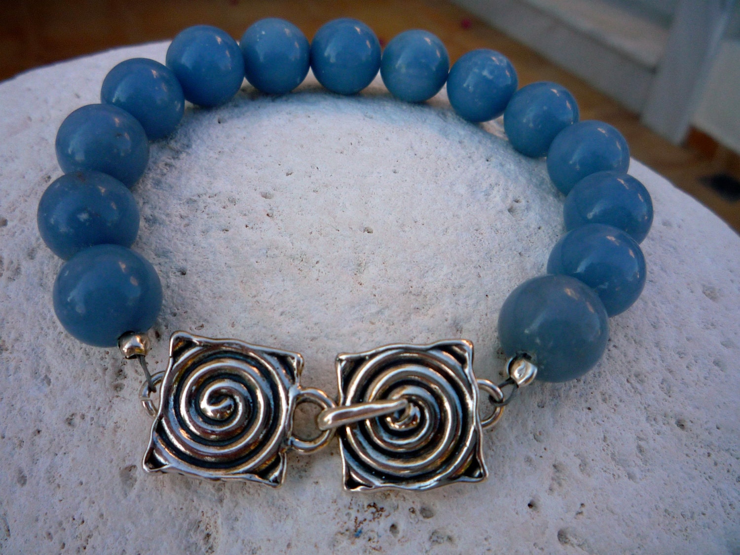 Angelite semiprecious gemstones bracelet with spiral Sterling Silver closure.