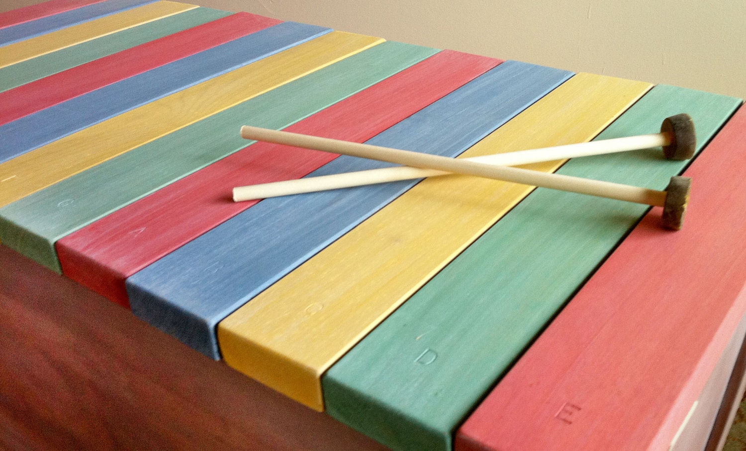 Wooden xylophone lid on cedar chest. Easy to play, built to last.