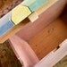 Wooden xylophone lid on cedar chest. Easy to play, built to last.