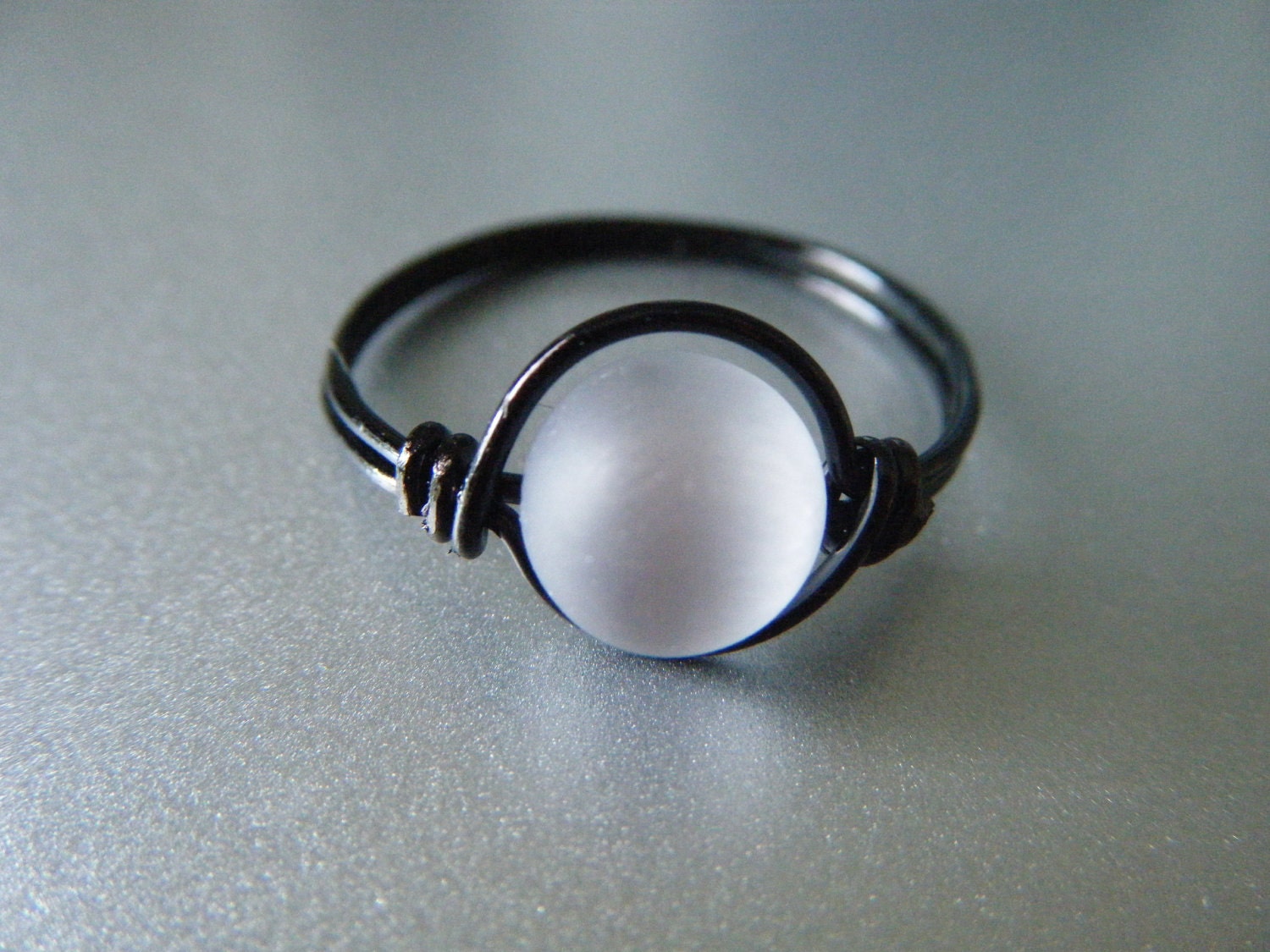 A Drop of Rain - Silver Cats Eye Ring - Black Wire - Made to order