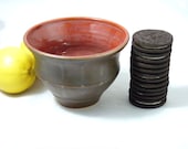 Small Bowl glazed in satiny walnut brown and glossy red.