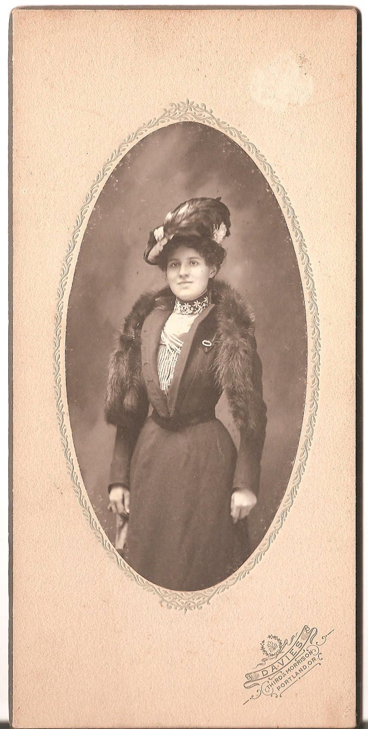 Early photo of stylish Lady with a Fur around her neck....