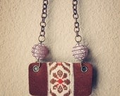 chelsa.  a statement necklace made of leather, textile and ethnic beads.