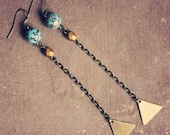 adelaine.  a pair of teal and gold geometric earrings.