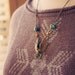 RESERVED FOR NAVIWING skylar.  a beaded brass bird in flight necklace.