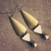 hazel. a pair of golden tribal geometric earrings.