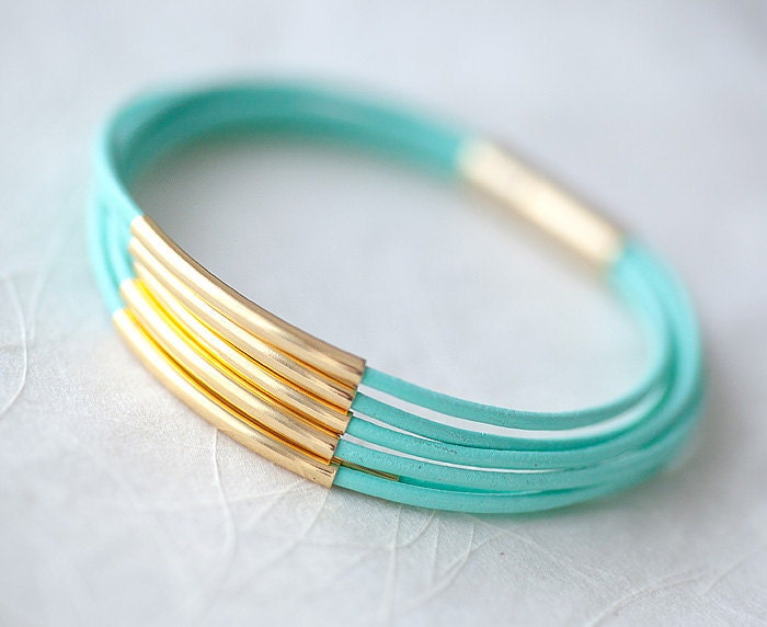 Resreved for Monica T: Mint Green Leather Bracelet with 6 Golden tubes by pardes israel