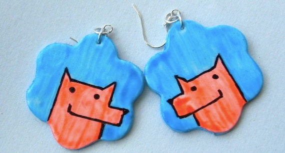 Earrings with puppies that glow in UV-light