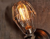 Industrial wall sconce with vintage style light bulb cage