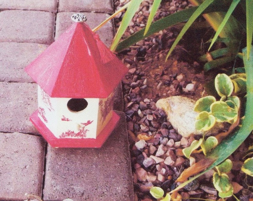 Decorated wooden birdhouse, red pagoda with button and tassel,