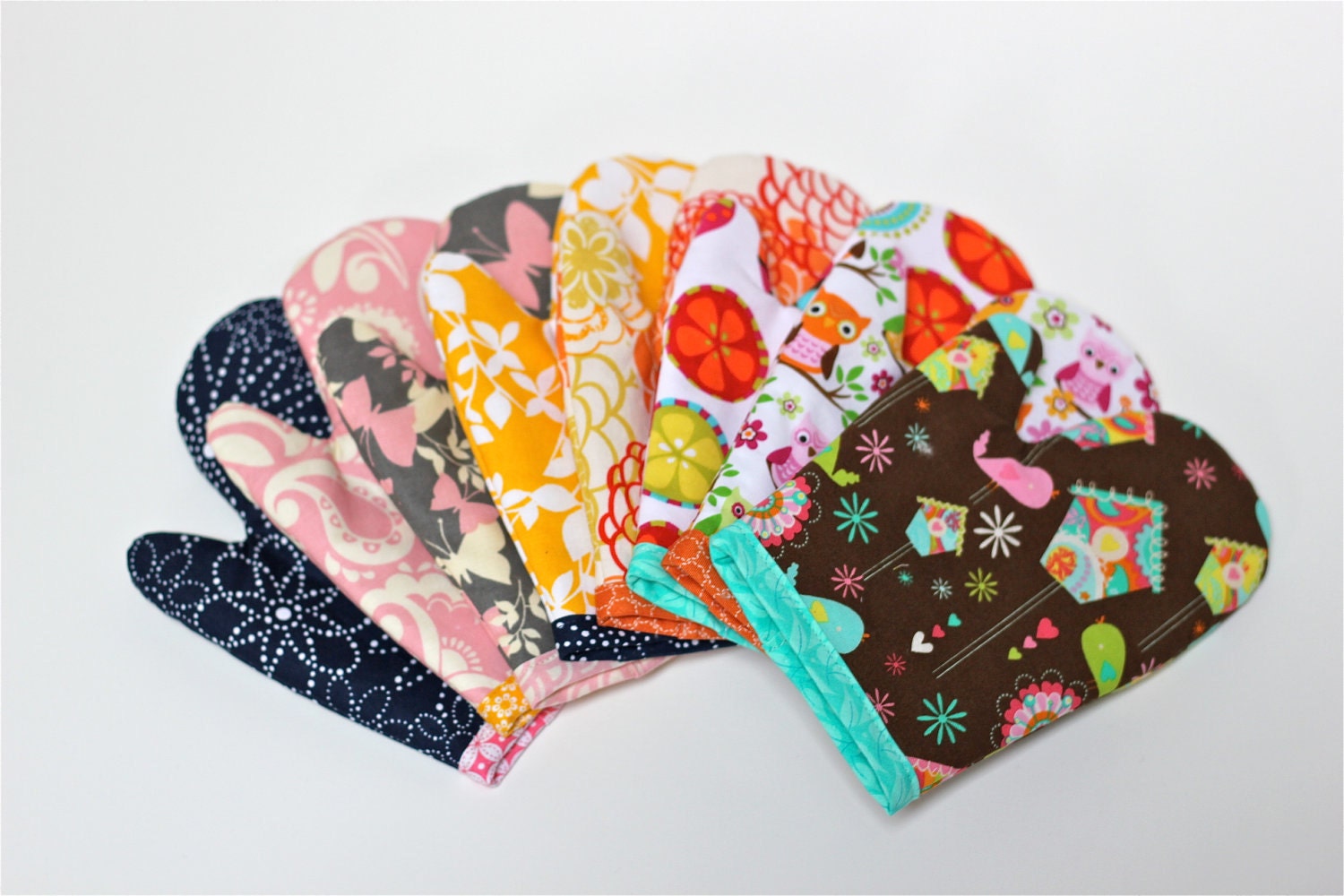 Girls play oven mitt