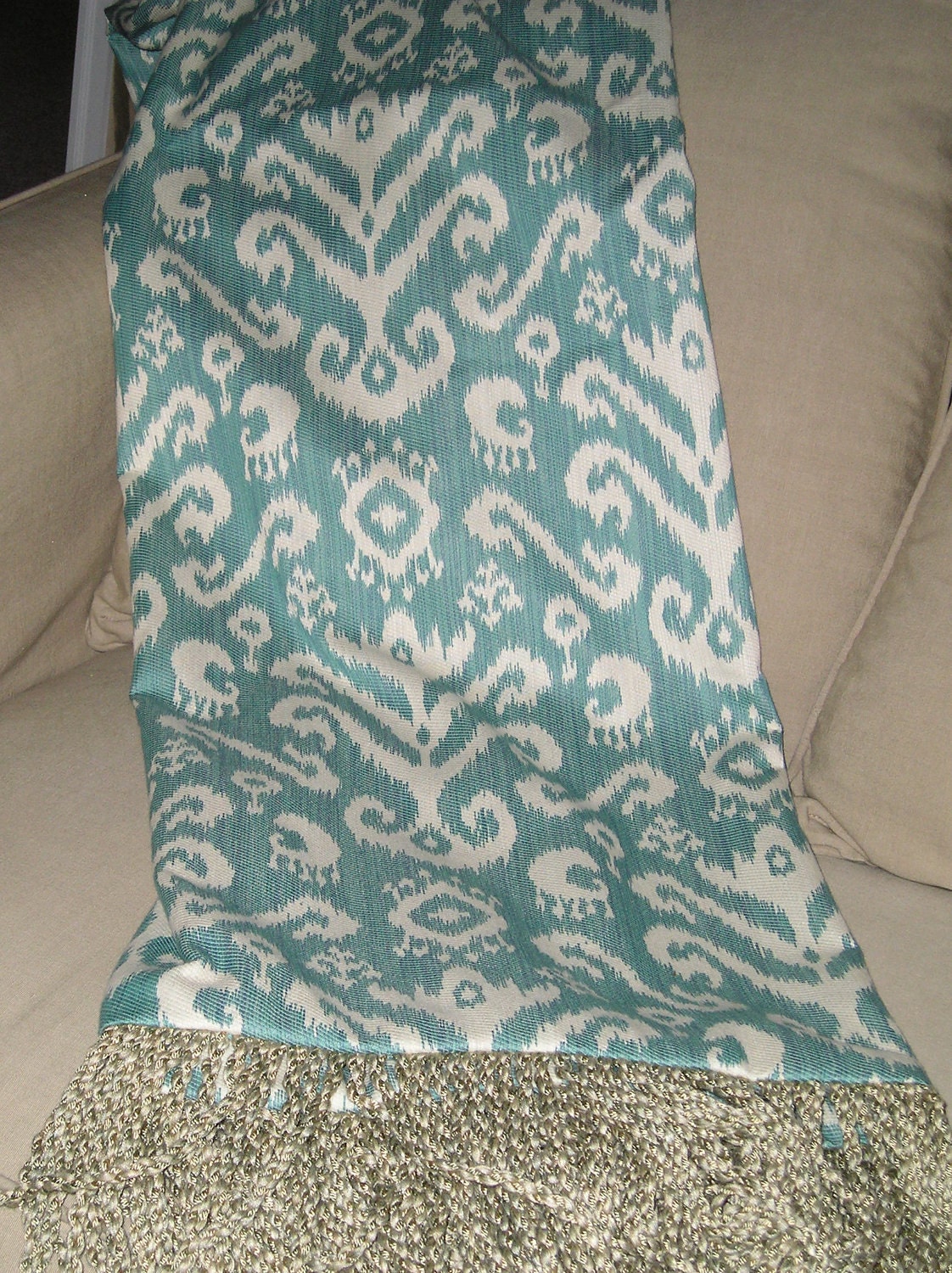 Turquoise and cream Ikat one of a kind throw blanket, distinctive designer home accessory item.