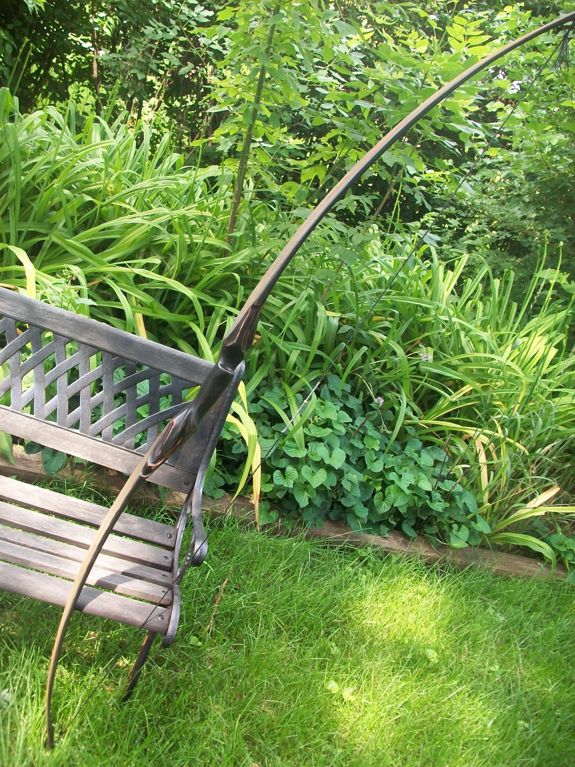 Cathal longbow, fantasy styled functional archery sculpture, custom carved wood bow.