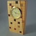 Desk clock of box elder with inlaid squares.