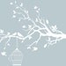 White tree branch with a bird cage and birds wall decal -