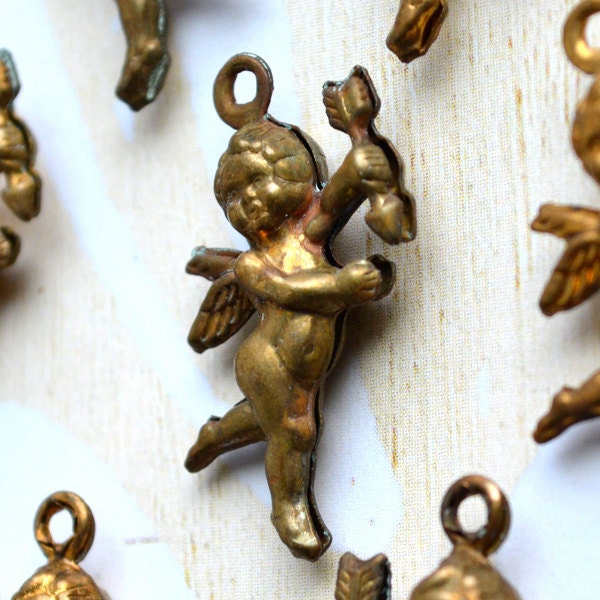 3D vintage cupid cherub finding or tin charm SET OF 4 offered by Elizabeth Rosen