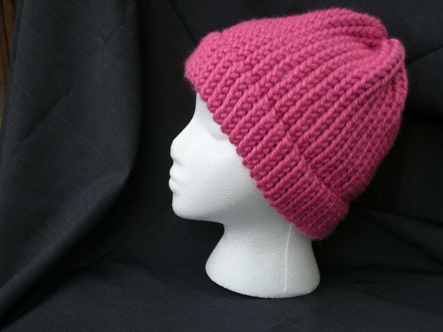 Bright pink knitted hat