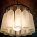 Wine Bottle Chandelier, Black Wrought Iron texture with Frosted Bottles