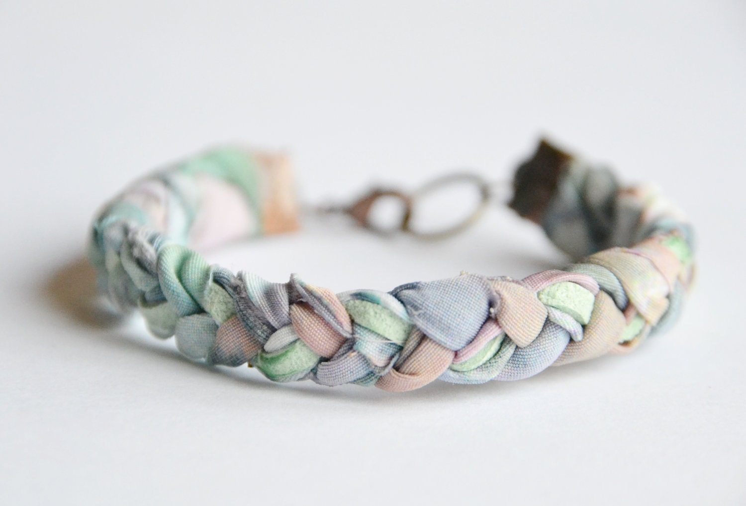 Fabric and suede bracelet. Pastel fabric braided with mint suede. Mint, rose, sky blue colors. Copper findings. Small Size.