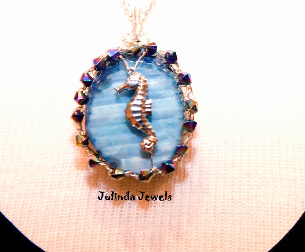 Oval Blue Agate Pendant Necklace Sterling Silver Wire Wrapped with Silver Sea Horse Charm and Crystal Beads.