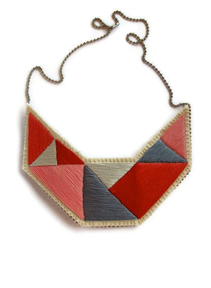 Embroidered necklace in geometric pinks reds and grays