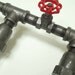 Vanity Lamp. Beer bottles, Plumbing pipe & fittings. Wall light. Bathroom Vanity Lighting Fixture