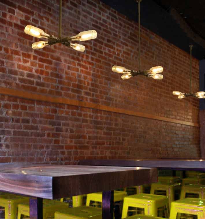 Wall Lamp. Beer bottles,  Plumbing pipe & fittings. Wall light.  Lighting Fixture. Ceiling lamp