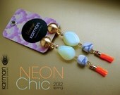 Colorful neon dangle earrings. White neon opal beads with howlite stones and orange neon silk fringe by Karman Jewelry.
