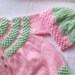 hand knitted baby cardigan / jacket and matching hat / bonnet pinks/ greens /strawberry buttons