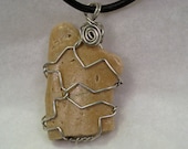 natural beach stone necklace with a wire wrapped tan stone pendant