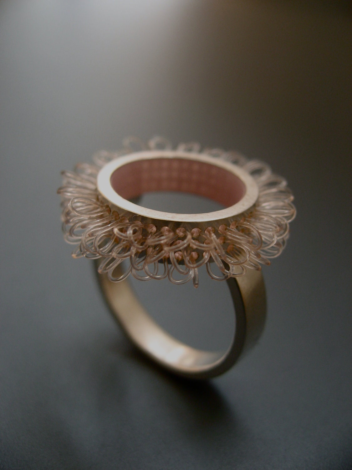 Ring sterling silver and plastic, Diameter of ring top 21mm, color rose pink, design "loops in circles"
