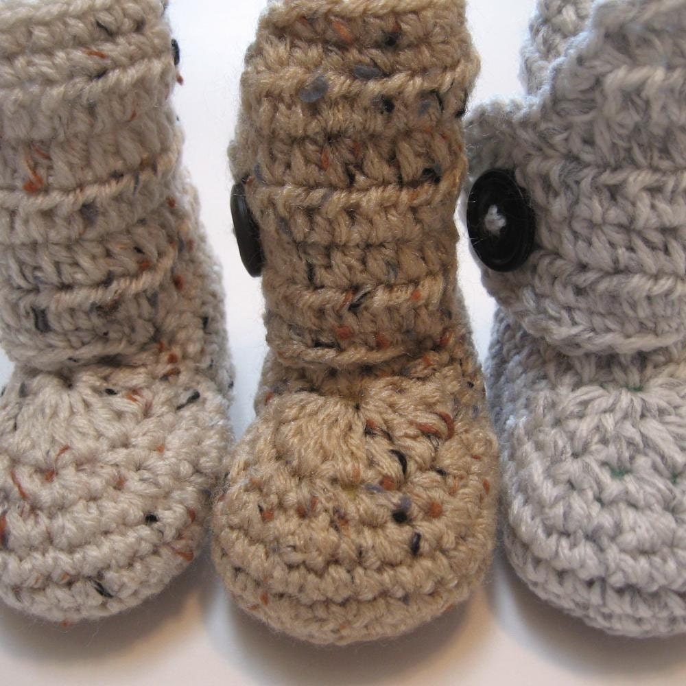 Baby booties.  Infant sizes.  One button ankle boots.  Unisex booties.  Gender neutral booties.  Ankle boots for baby boys or baby girls.