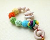 Teething toy rattle with crochet wooden beads and 3 wooden rings. Yellow, orange, green, aqua blue/ cyan.