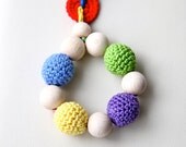 Teething toy with crochet wooden beads. Yellow, blue, red, green, violet.
