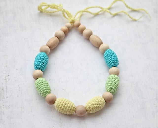 Teething necklace in aqua blue/ turquoise, light yellow and light green. Crochet wooden beads nursing necklace for her.