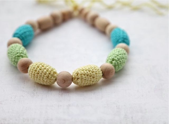 Teething necklace in aqua blue/ turquoise, light yellow and light green. Crochet wooden beads nursing necklace for her.