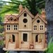 Birdhouse "Three Townhouses", wood and wine corks.