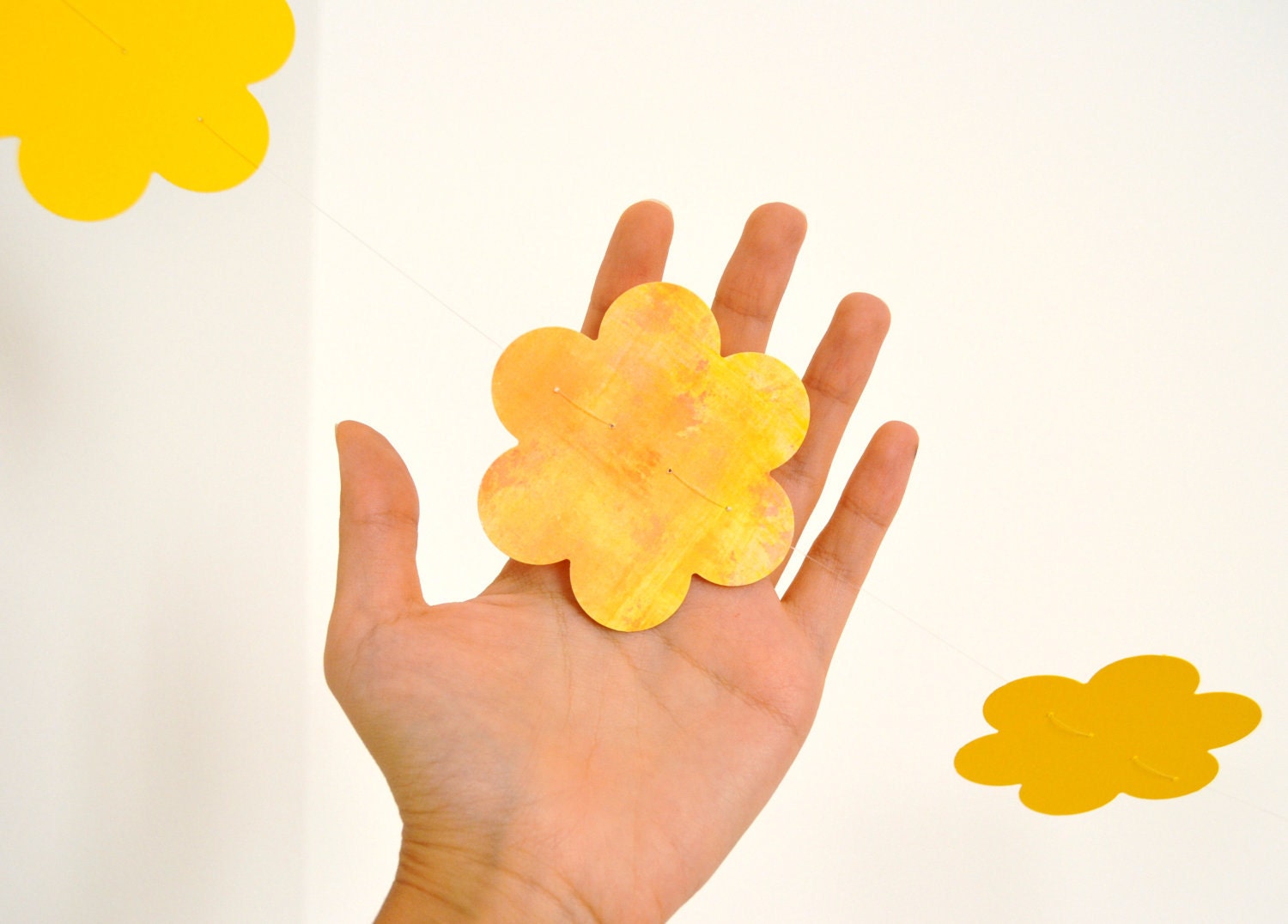 Yellow garland with paper flowers