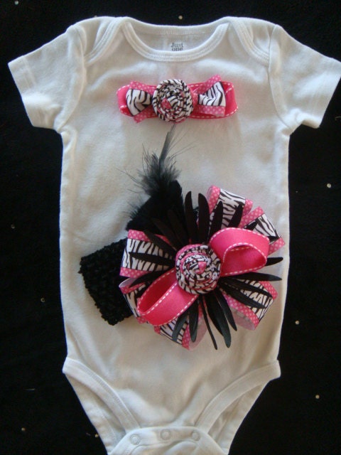 Baby gilr hot pink zebra print ribbon onesie bodysuit with matching headband oversized bow, feather, flowers.