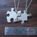 Two Silver Puzzle Piece Pendants
