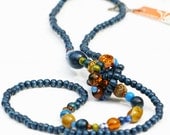 Long beaded necklace, long wood necklace, rope, knot, dark blue, sodalite blue, amber, pantone fashion colours.