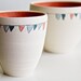Ceramic Bowls in Coral- Flag Decoration in Teal, Coral, and Blue