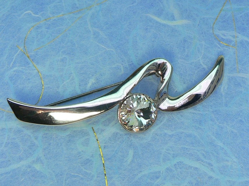 Silvertone Ribbon Brooch with Clear Rhinestone Center